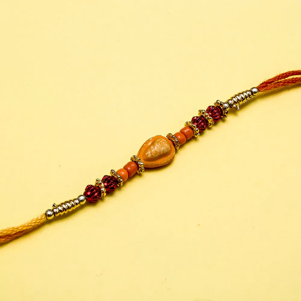 Shell with pearl string rakhi