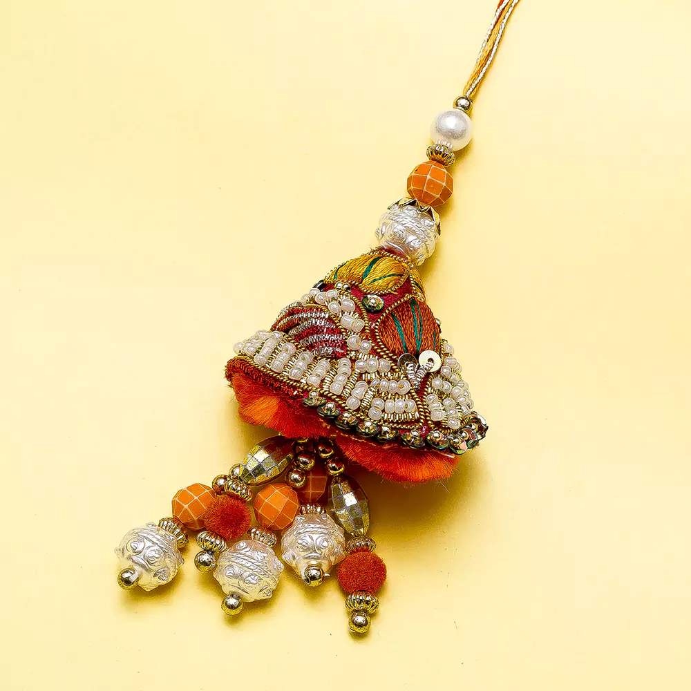 Handmade pearl art lumba rakhi