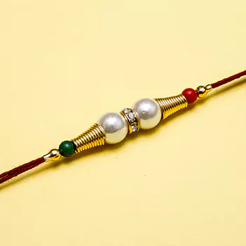 Great art of pearl and diamond rakhi
